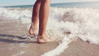 Jumping in the sea waves on the beach