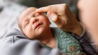 Little baby boy enjoying in mother's touch