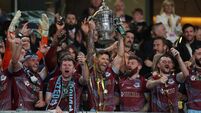 Adam Foley lifts the cup 10/11/2024