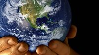 Man with planet earth in hands
