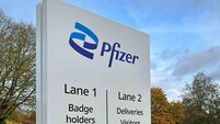 Pfizer lifts profit view as cuts offset flat sales outlook